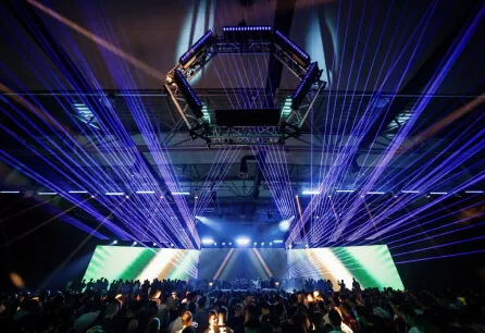 Hexagonal light rig and lasers above the TMRW crowd
